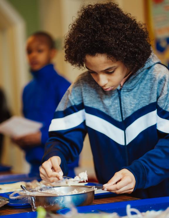 A boy enjoying lunch time