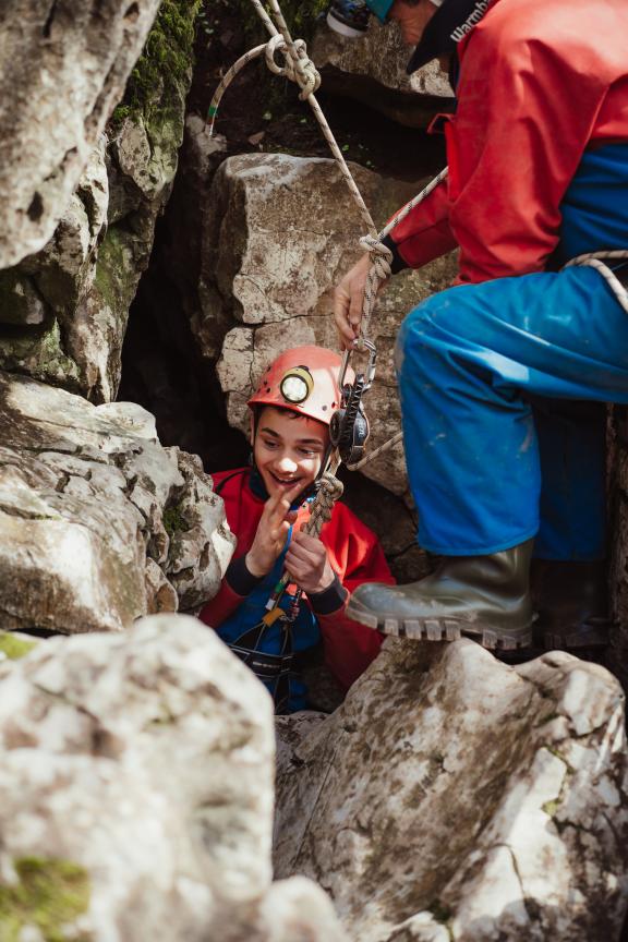 Abseiling into the cave
