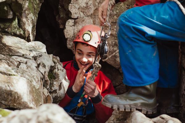 Abseiling into the cave