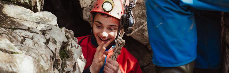 Abseiling into the cave