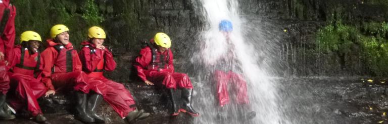 Group in waterfall 